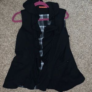 Black ruffle vest